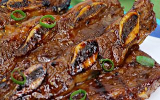 picture of asian hawaiian bbq short rib on a white tablecloth