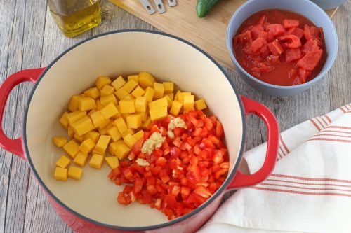 Here we see the cubed vegetables going into the pot to make vegetarian chili.