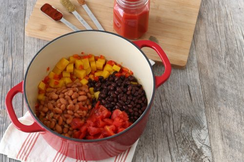 Next we have to add the beans to our butternut squash chili before any liquid is added.