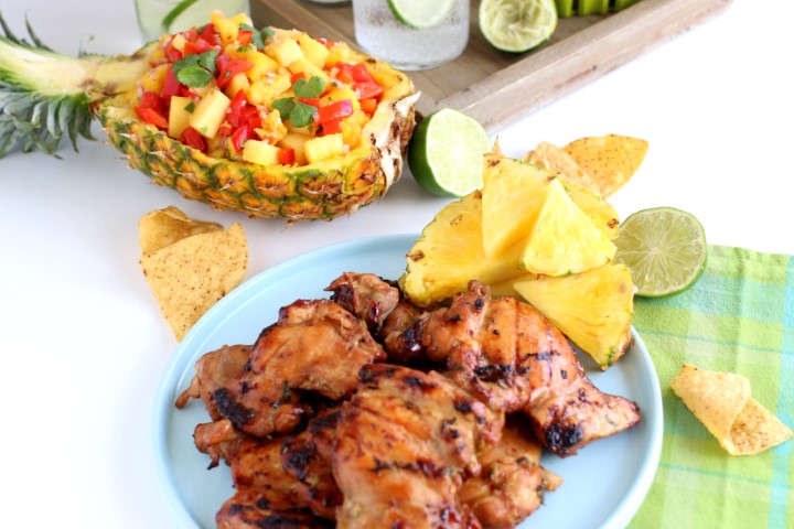 Grilled marinated chicken served with sparkling water and pineapple salsa.