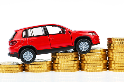 Model car and coins. car costs