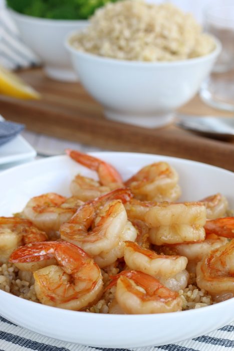 Image shows the finished easy shrimp recipe being served over rice for a healthy dinner recipe. 
