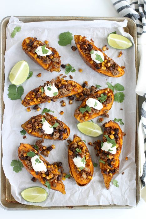 Overhead view of baked sweet potatoes with ground beef and mexican spices.