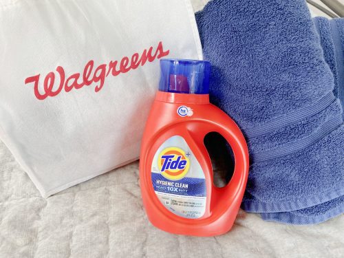 Tide Bottle near Walgreens bag with blue bath towels